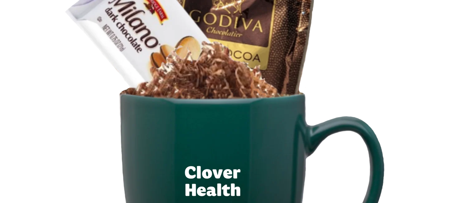 Clover green mug filled with cookies and hot chocolate