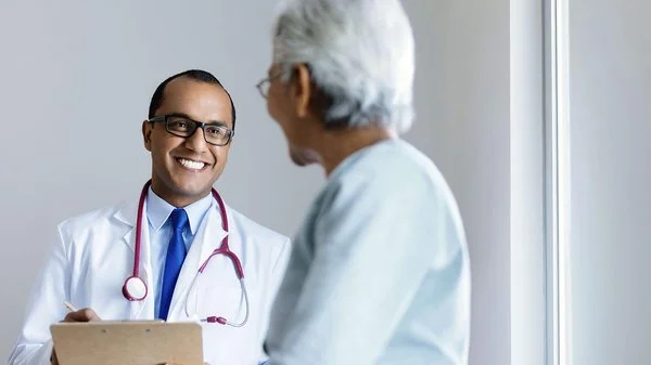 Doctor consults patient.