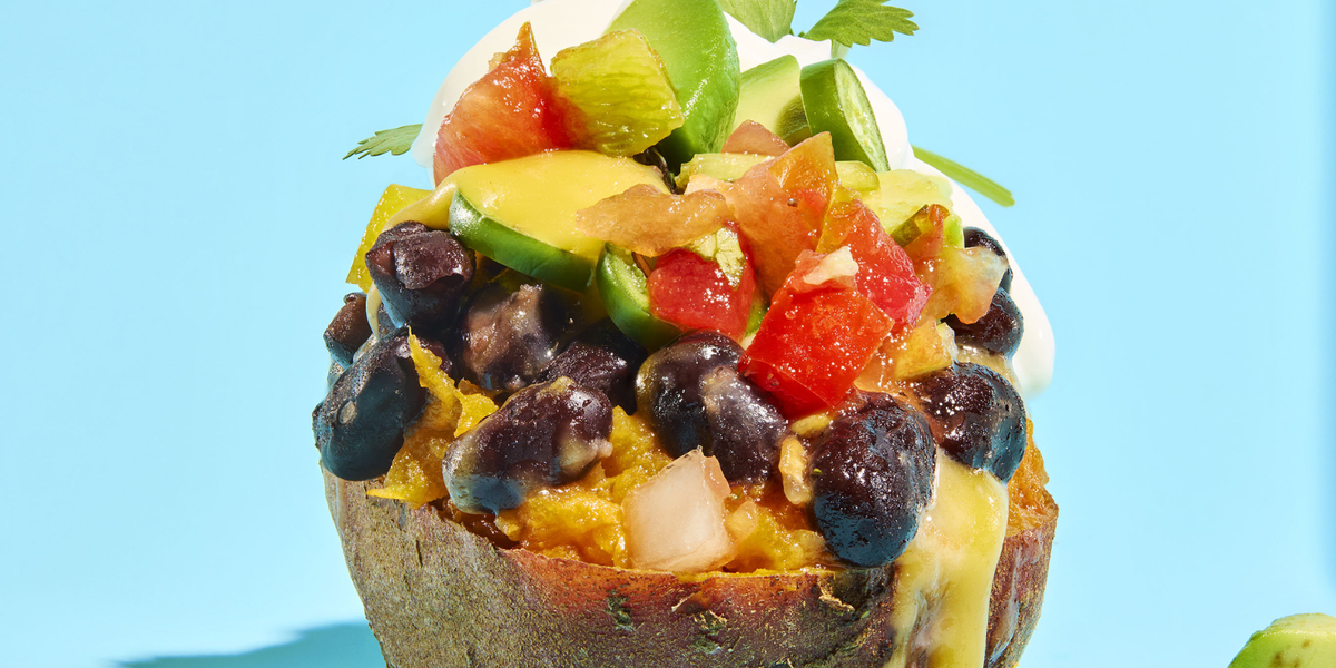 Image of a stuffed sweet potato taco against a blue background