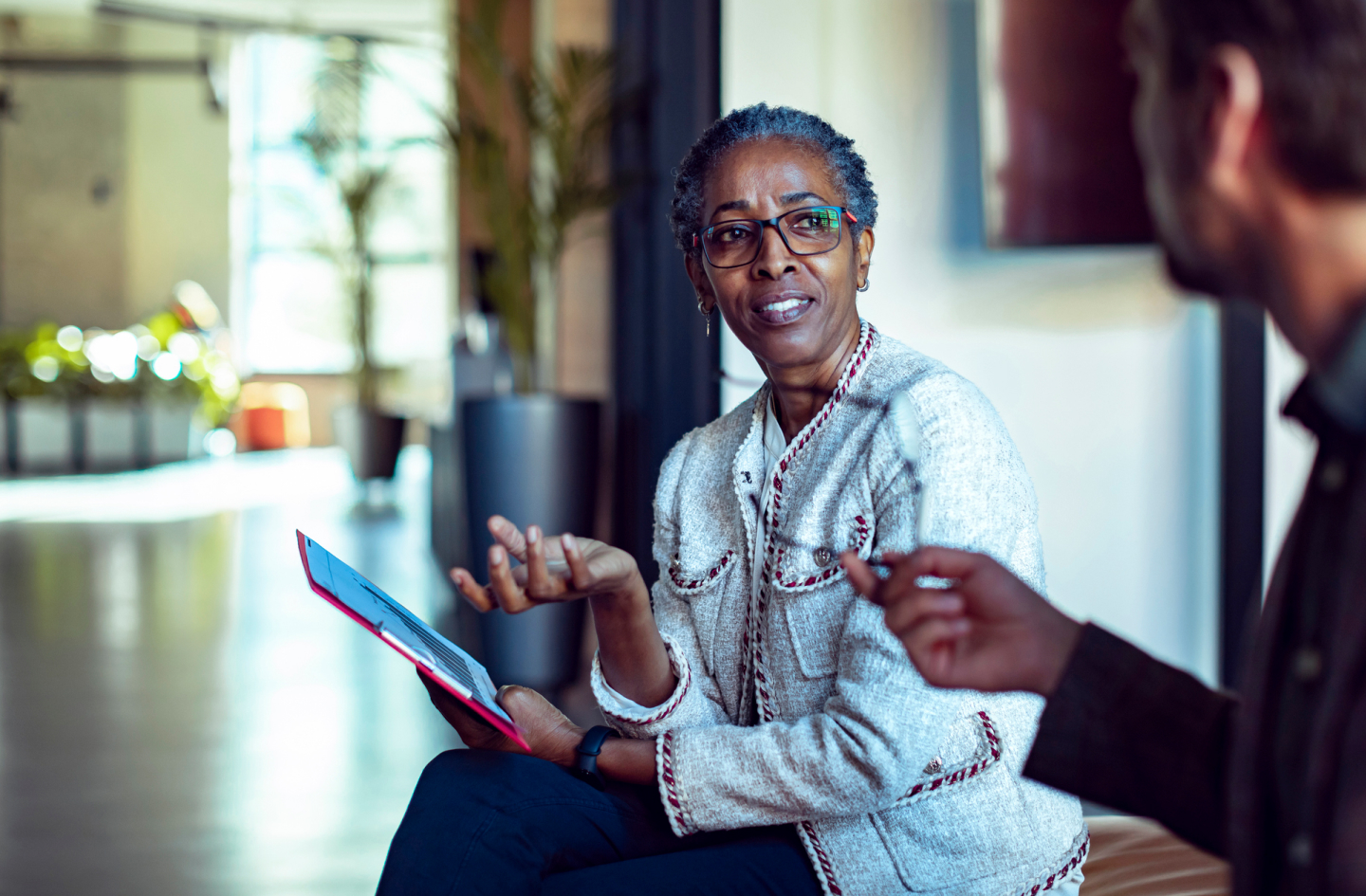 Woman sitting on a couch having a conversation