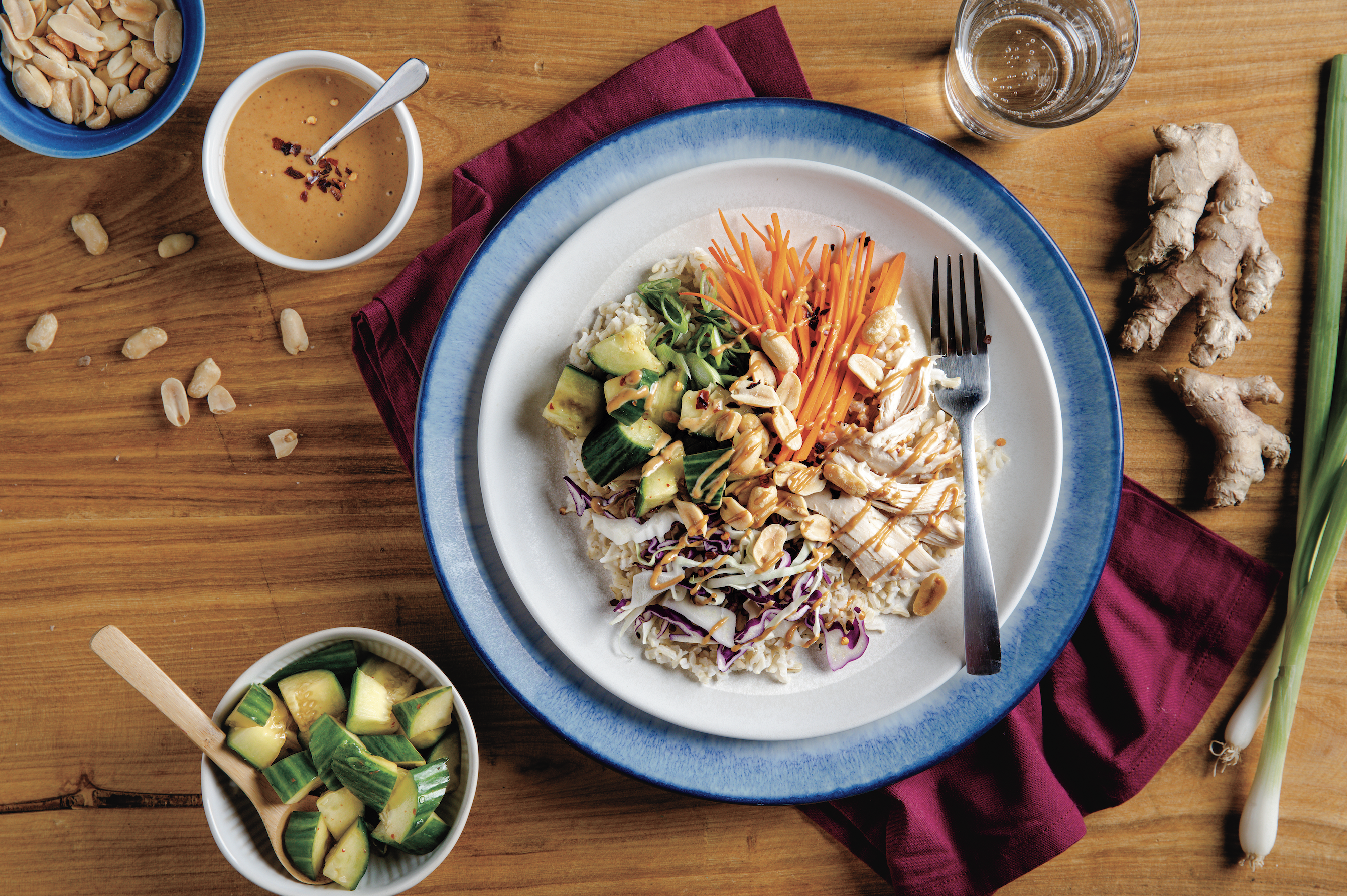 Peanut Chicken Bowl plated on a wooden table