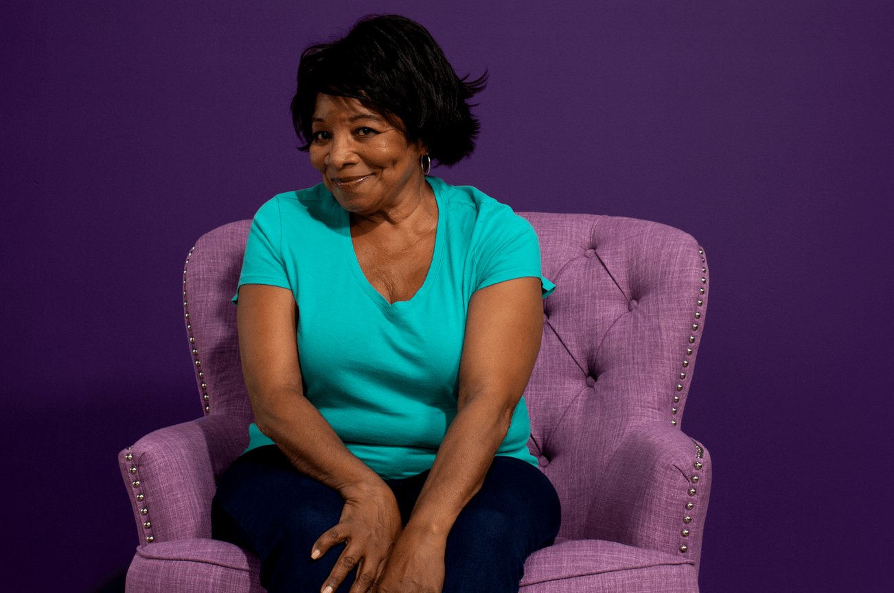 Member sitting in a purple chair