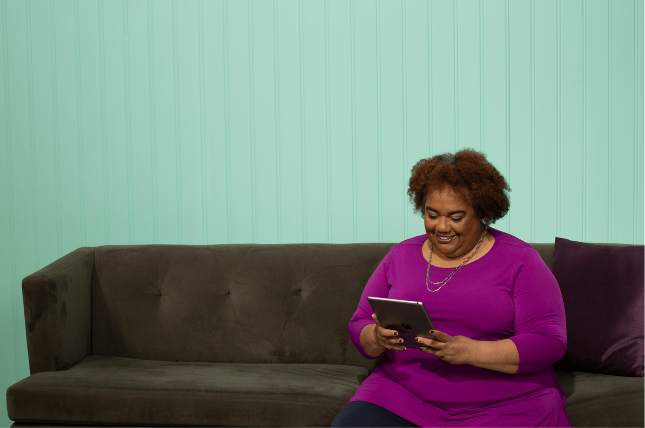 woman talking to family via video chat on tablet